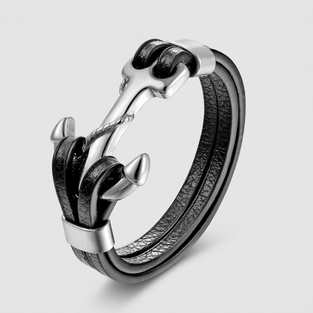 Silver and black leather ring on a white background