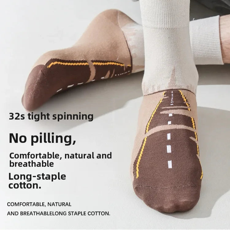 Brown socks with road design on a white background, featuring text about comfort and material.