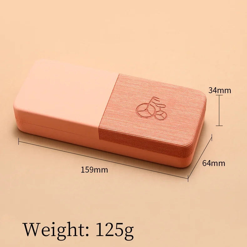 Pink yoga block with measurements and weight information on a beige background