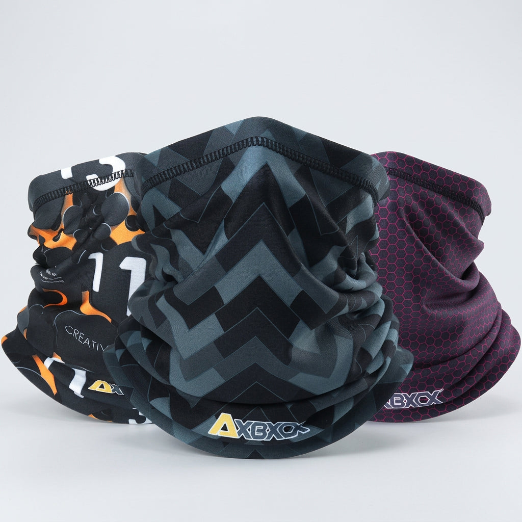 Four patterned neck gaiters with visible brand logos on a white background