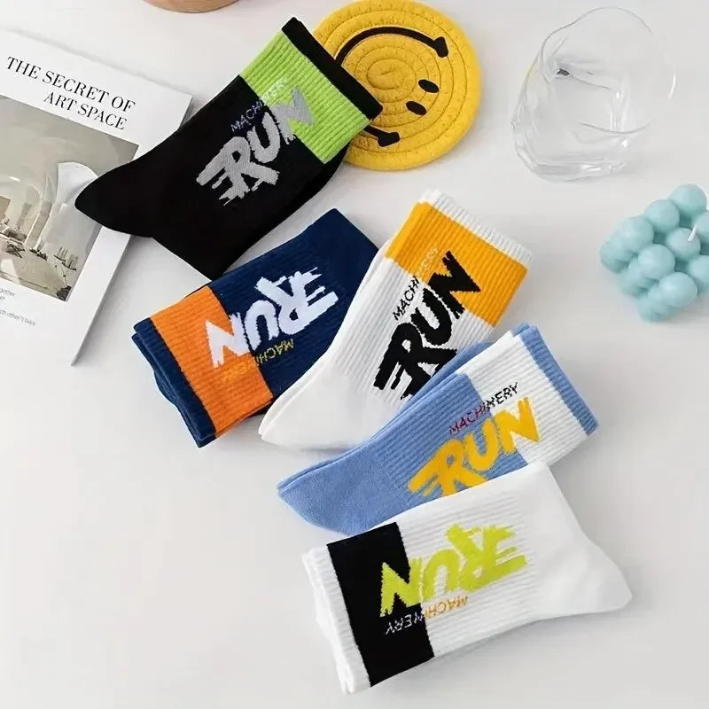 Colorful socks with text on a white surface