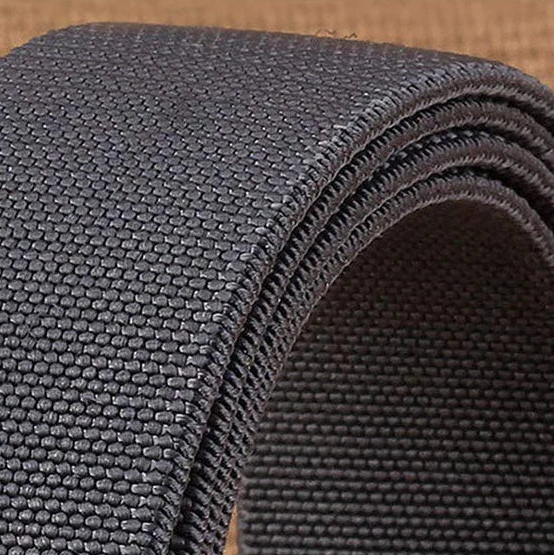 Roll of high-quality nylon belt body on a brown background