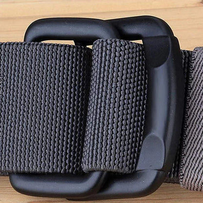 Gray belt with matte alloy buckle on a wooden surface