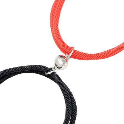 Black and red braided bracelets with silver clasp on a white background