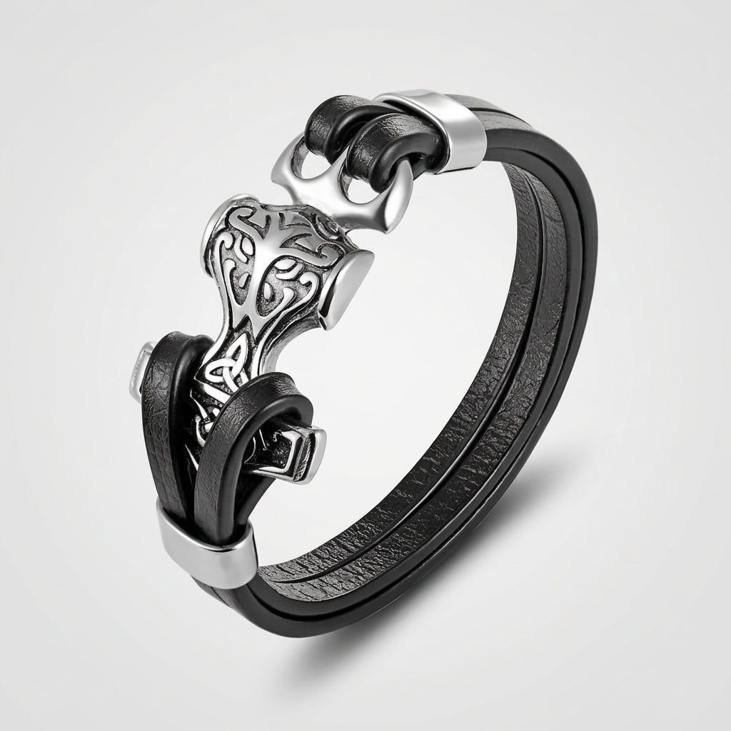 Black leather bracelet with silver clasp on a white background