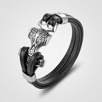 Black leather bracelet with silver clasp on a white background