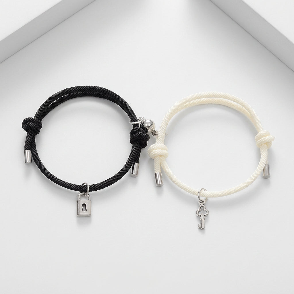 Black and white bracelets with charms on a white background