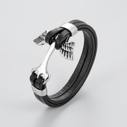 Black leather bracelet with silver metal elements on a white background