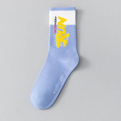 Light blue sock with yellow text on a gray background