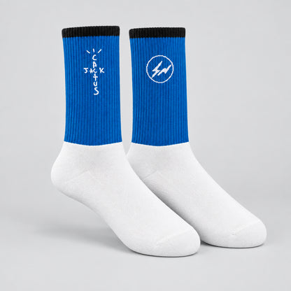 Blue and white crew socks with black cuffs, white cross-shaped lettering and a circular lightning design.