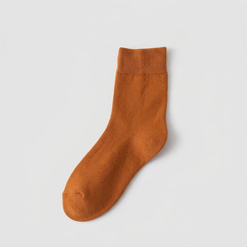 Brown sock on a beige background