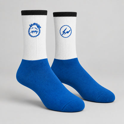 White and blue crew socks with black cuffs, a blue face graphic and a circular lightning design.