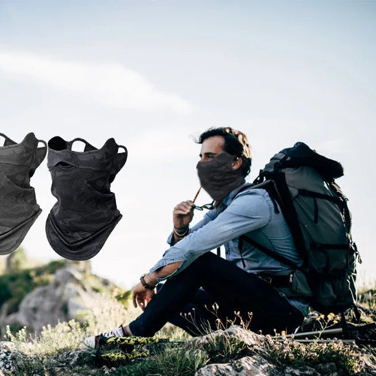Set of neck gaiters displayed with a person sitting on a rock in a mountainous area.