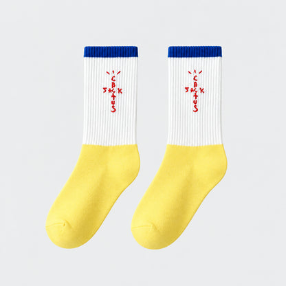 White and yellow crew socks with blue cuffs and red cross-shaped lettering.