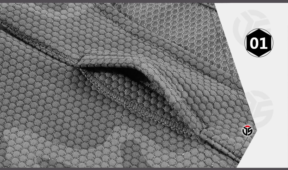 Close-up of textured gray fabric with a brand logo in the corner.