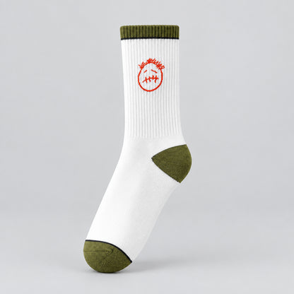 White crew sock with a red stitched-face graphic and olive cuff, heel, and toe, angled view