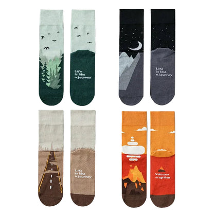 Set of socks with nature-themed designs and text on a white background