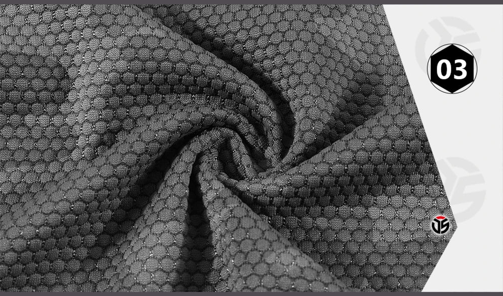 Close-up of textured gray fabric with a brand logo in the corner.