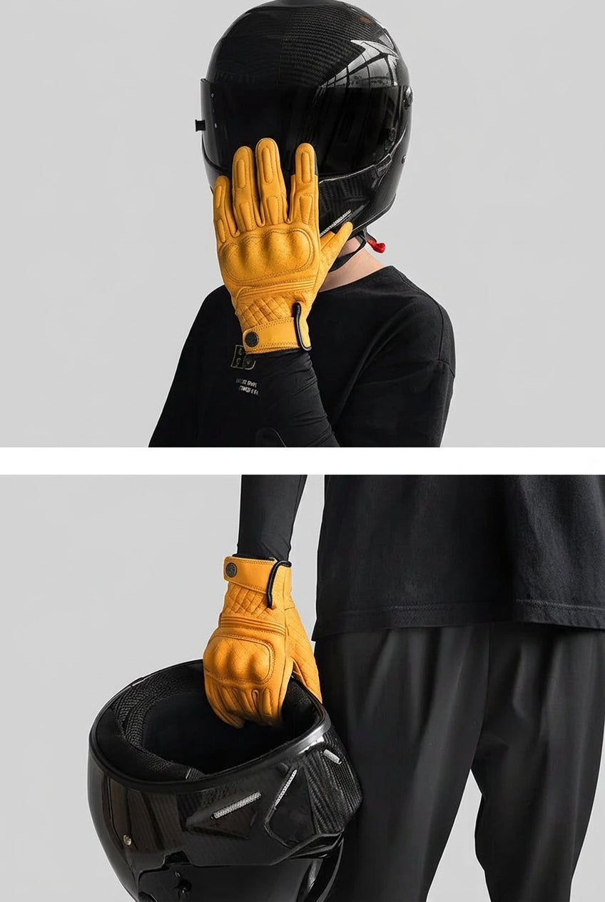 Person wearing a black helmet and yellow gloves with 'MJMOTO' branding.