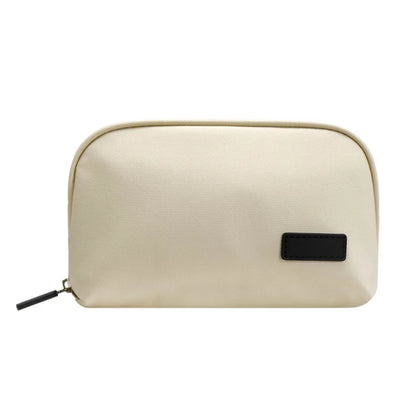 Beige organizer pouch shown closed with its black zipper pull.