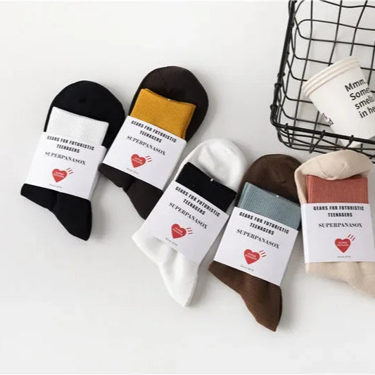 Set of colorful socks with labels on a white background