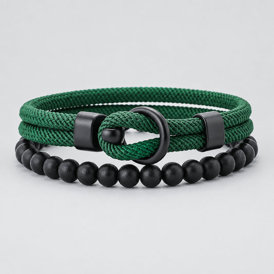 Two bracelets, one green rope-style and one black beaded, on a white background
