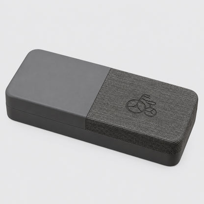 Gray yoga block with a textured surface on a beige background
