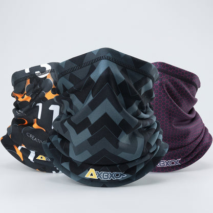 Four patterned neck gaiters with visible brand logos on a white background
