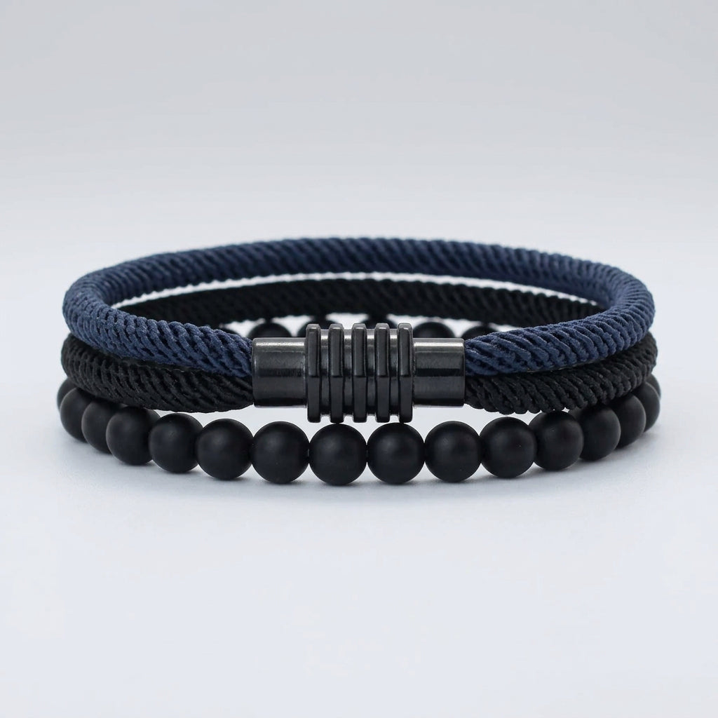 Two bracelets, one with a black braided rope design and the other with red, placed side by side with a silver-colored zinc alloy clasp.