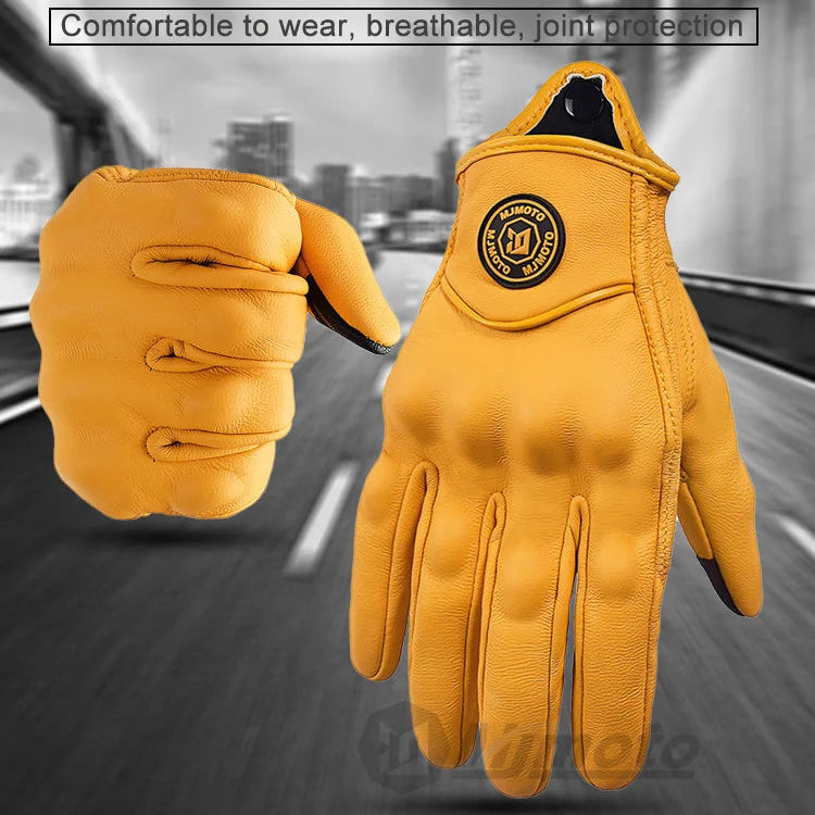 Yellow gloves with MJMOTO branding on a blurred road background