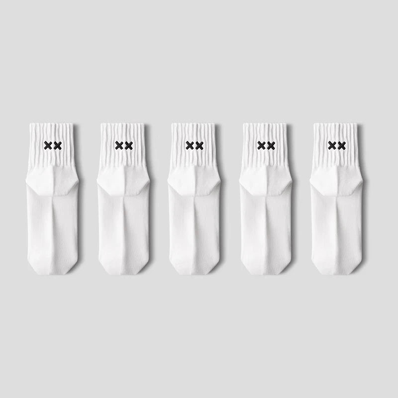 Five white socks with black X marks on a light gray background